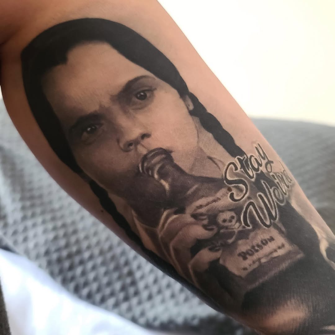 Wednesday Addams portrait tattoo, forearm