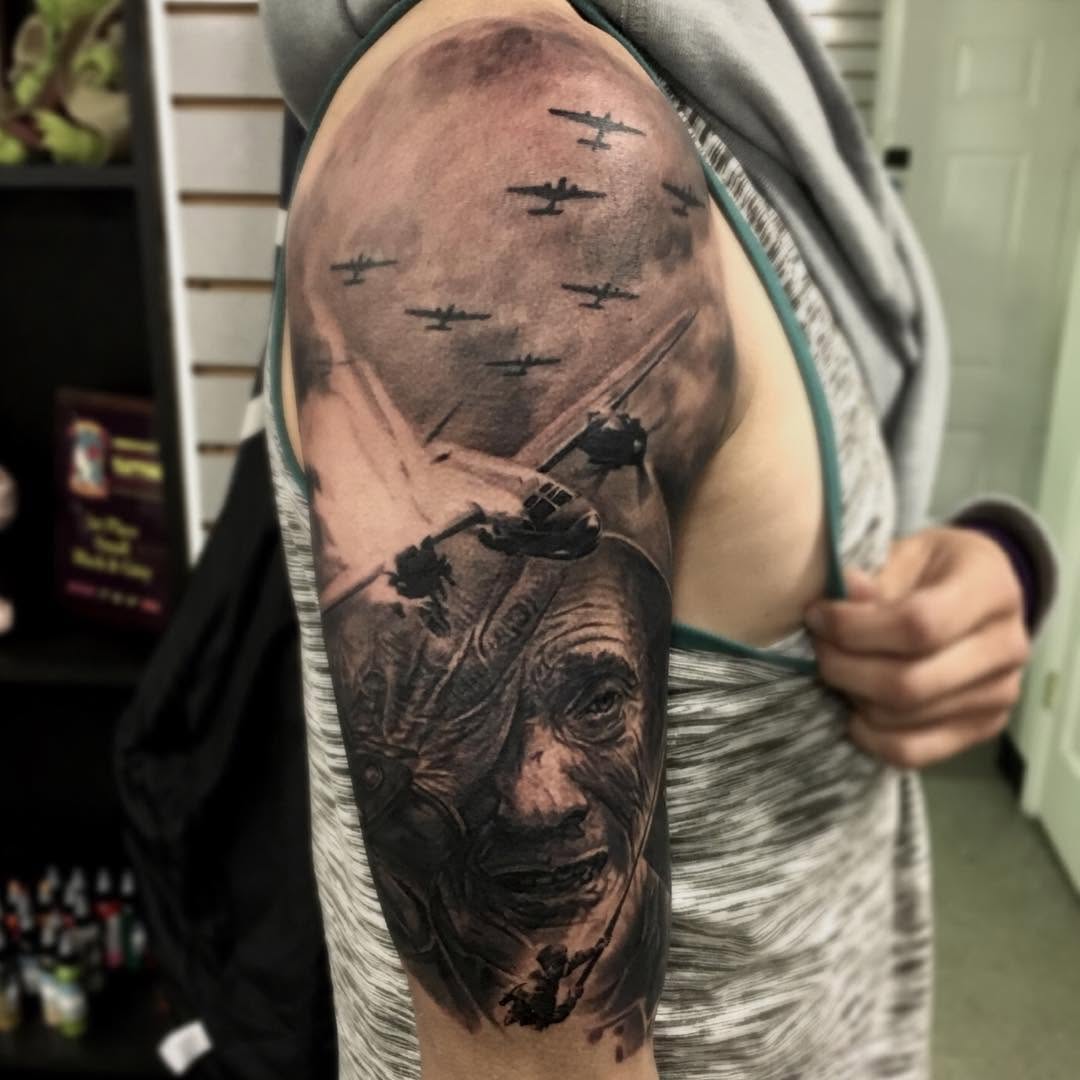 Black-and-grey WWII veteran portrait, half-sleeve