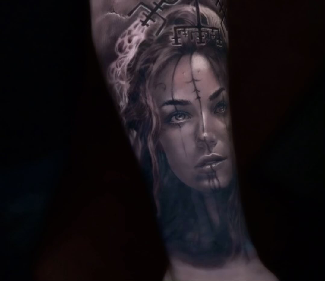 Black-and-grey Viking warrior portrait, forearm