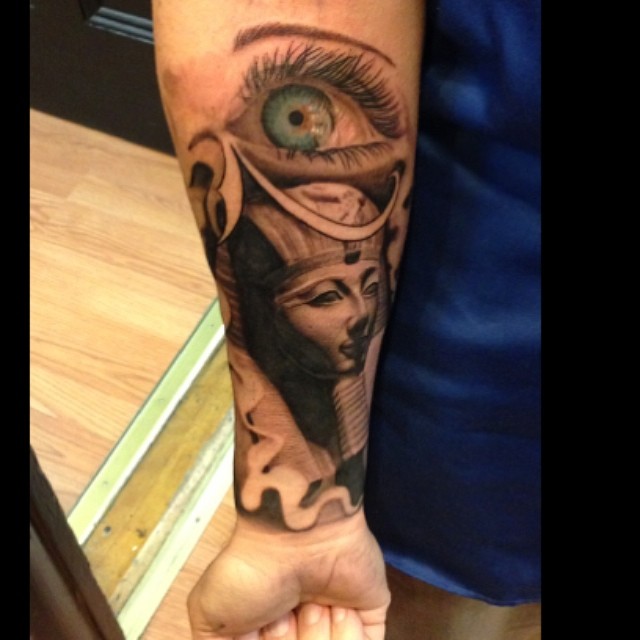 Egyptian Eye of Horus and pharaoh, forearm