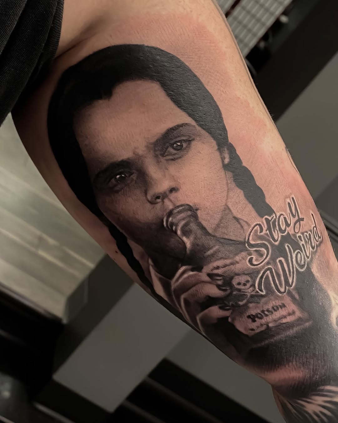 Wednesday Addams portrait tattoo, bicep