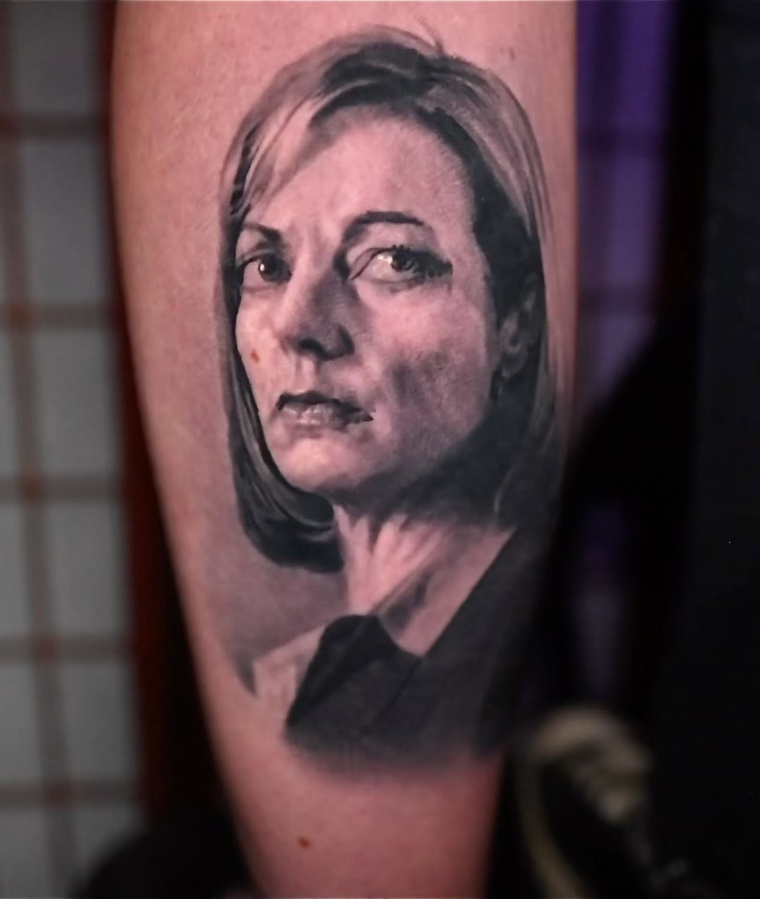Black-and-grey portrait tattoo of Allison Janney