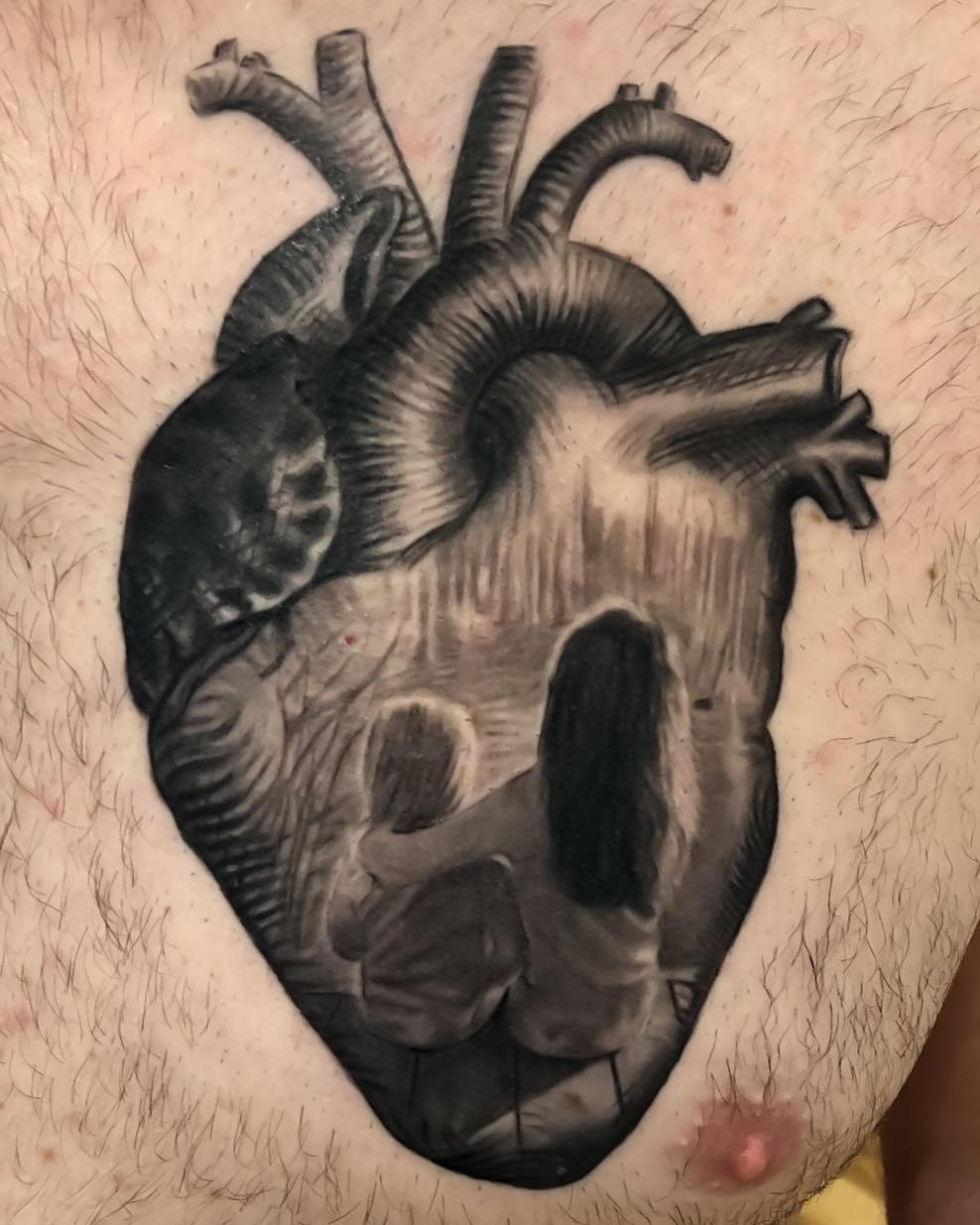Anatomical heart with family scene, chest