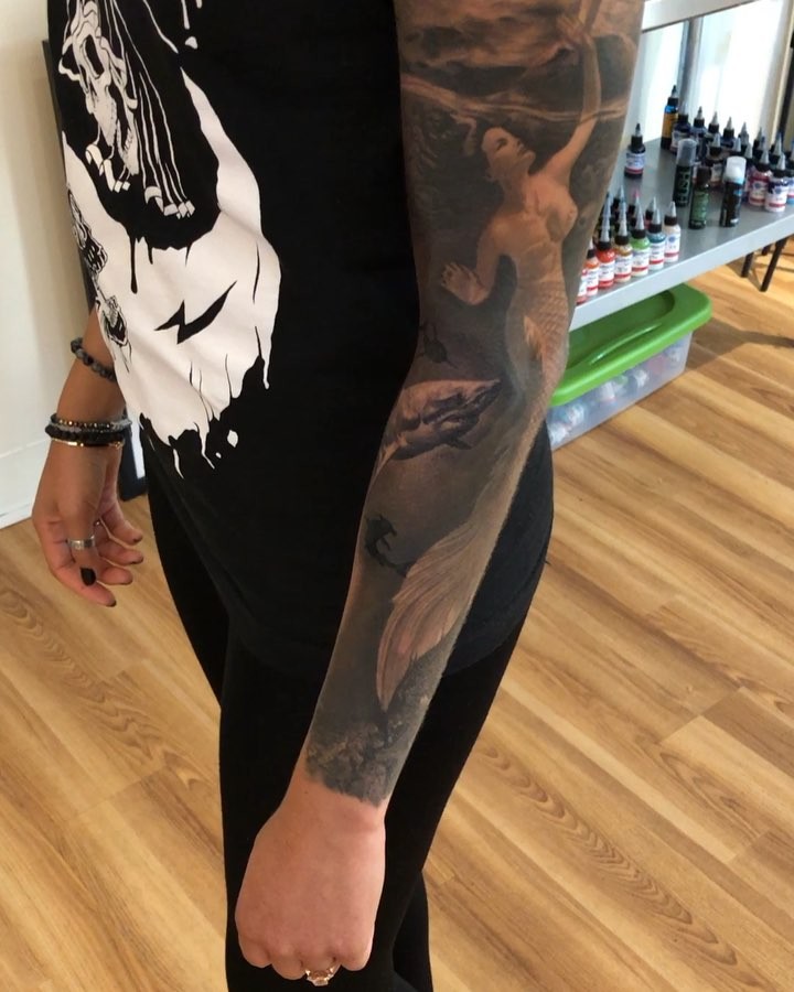 Black-and-grey mermaid sleeve tattoo