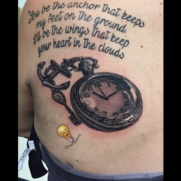 Black-and-grey pocket watch and anchor tattoo, back