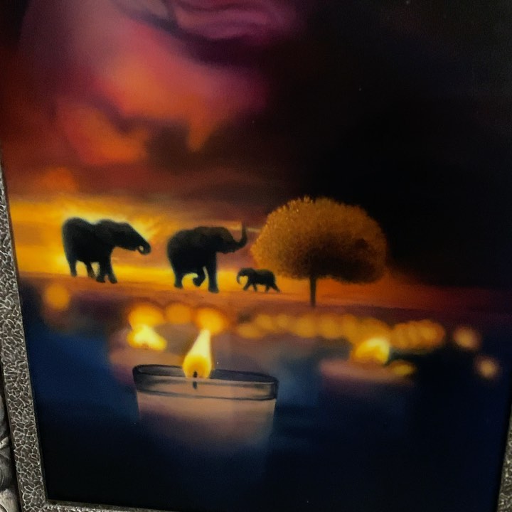 Airbrush painting of elephants at sunset
