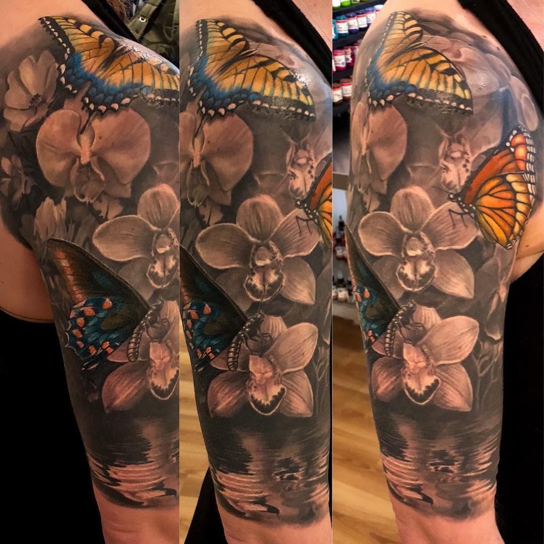 Orchids and butterflies half-sleeve tattoo