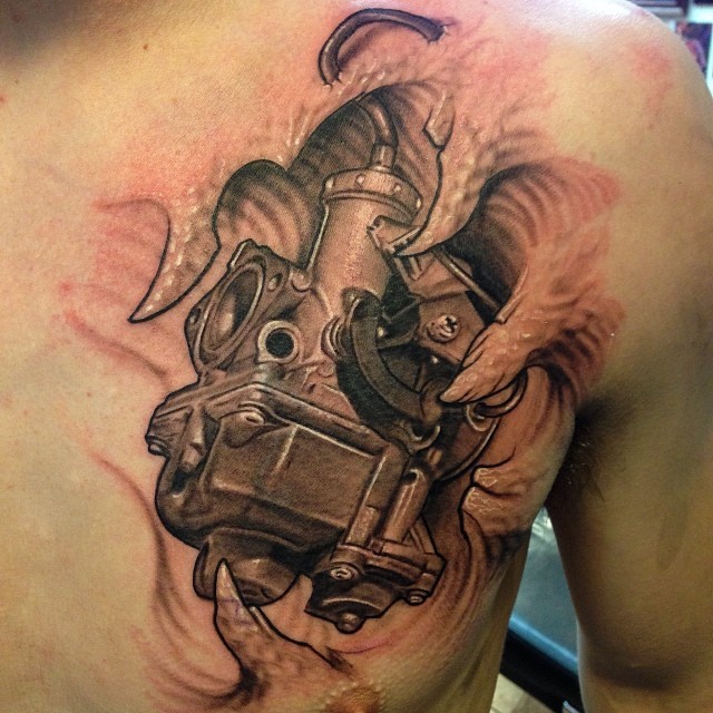 Biomechanical engine chest tattoo, black-and-grey