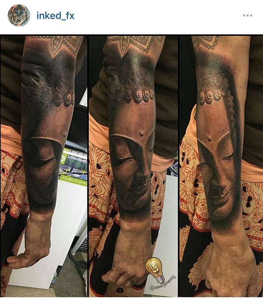 Black-and-grey Buddha portrait, forearm