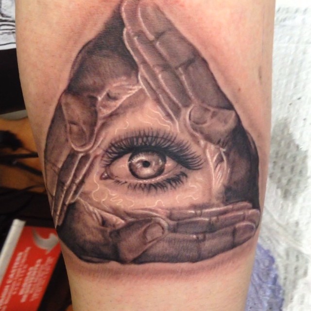 Black-and-grey all-seeing eye and hands tattoo