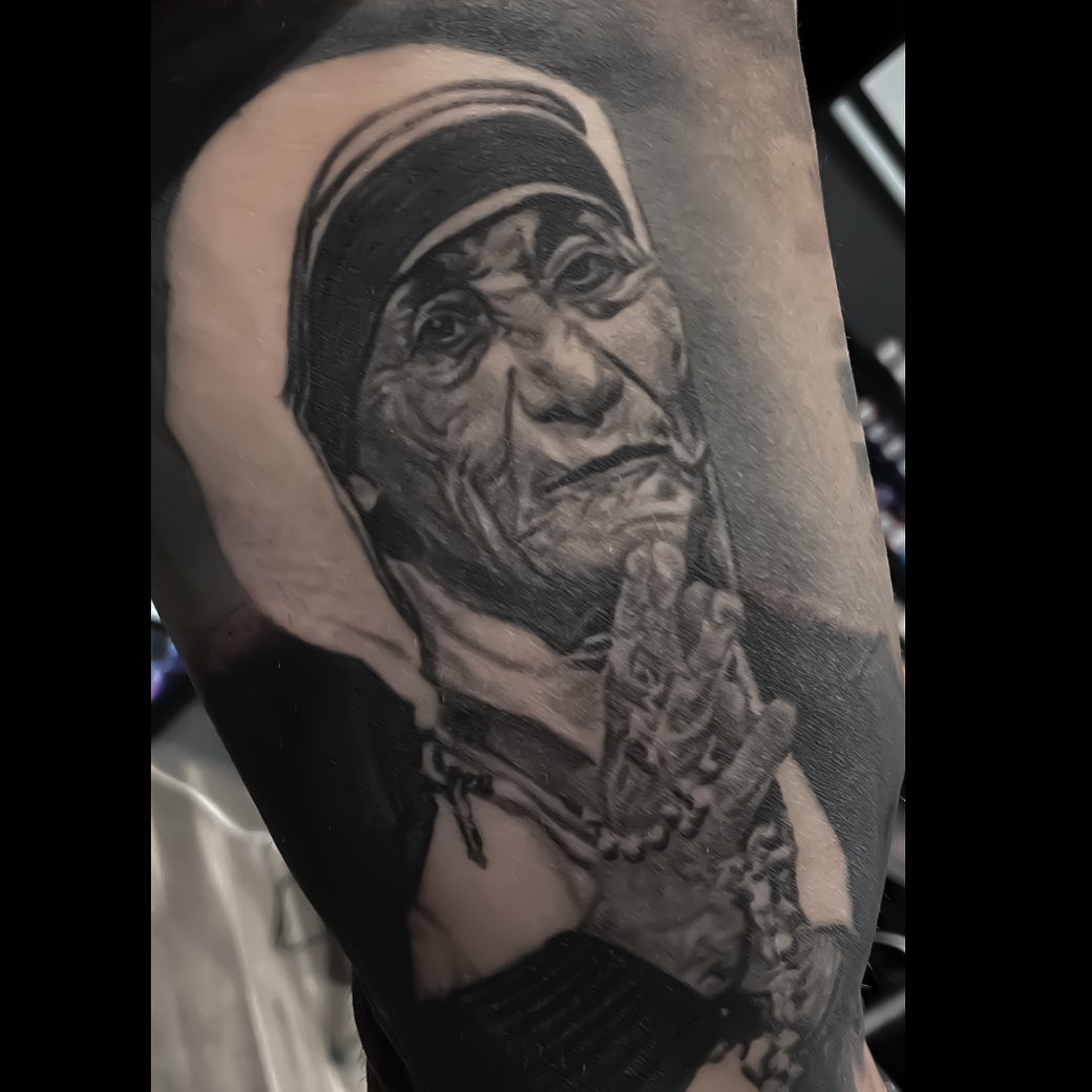 Mother Teresa black-and-grey portrait tattoo