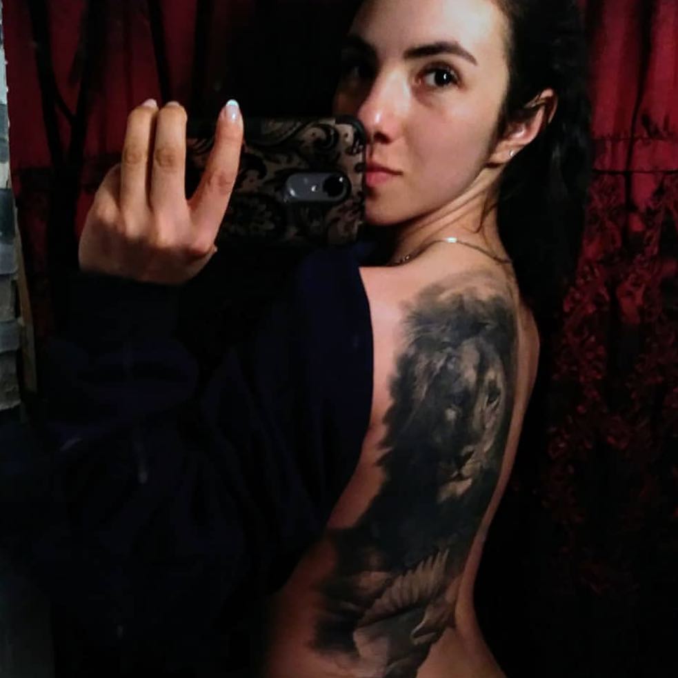 Black-and-grey lion back piece, healed
