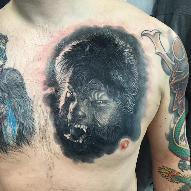 Black-and-grey werewolf cover-up tattoo, chest