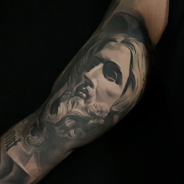 Black-and-grey Jesus portrait, inner arm