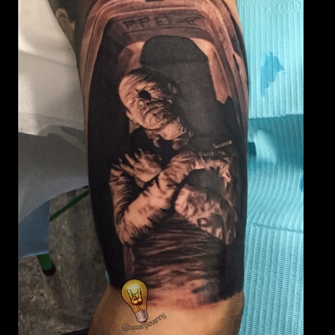 Black-and-grey Mummy tattoo, bicep