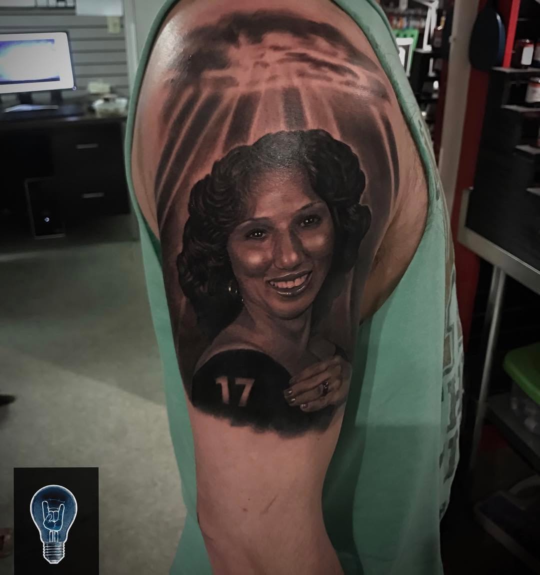 Black-and-grey memorial portrait, bicep