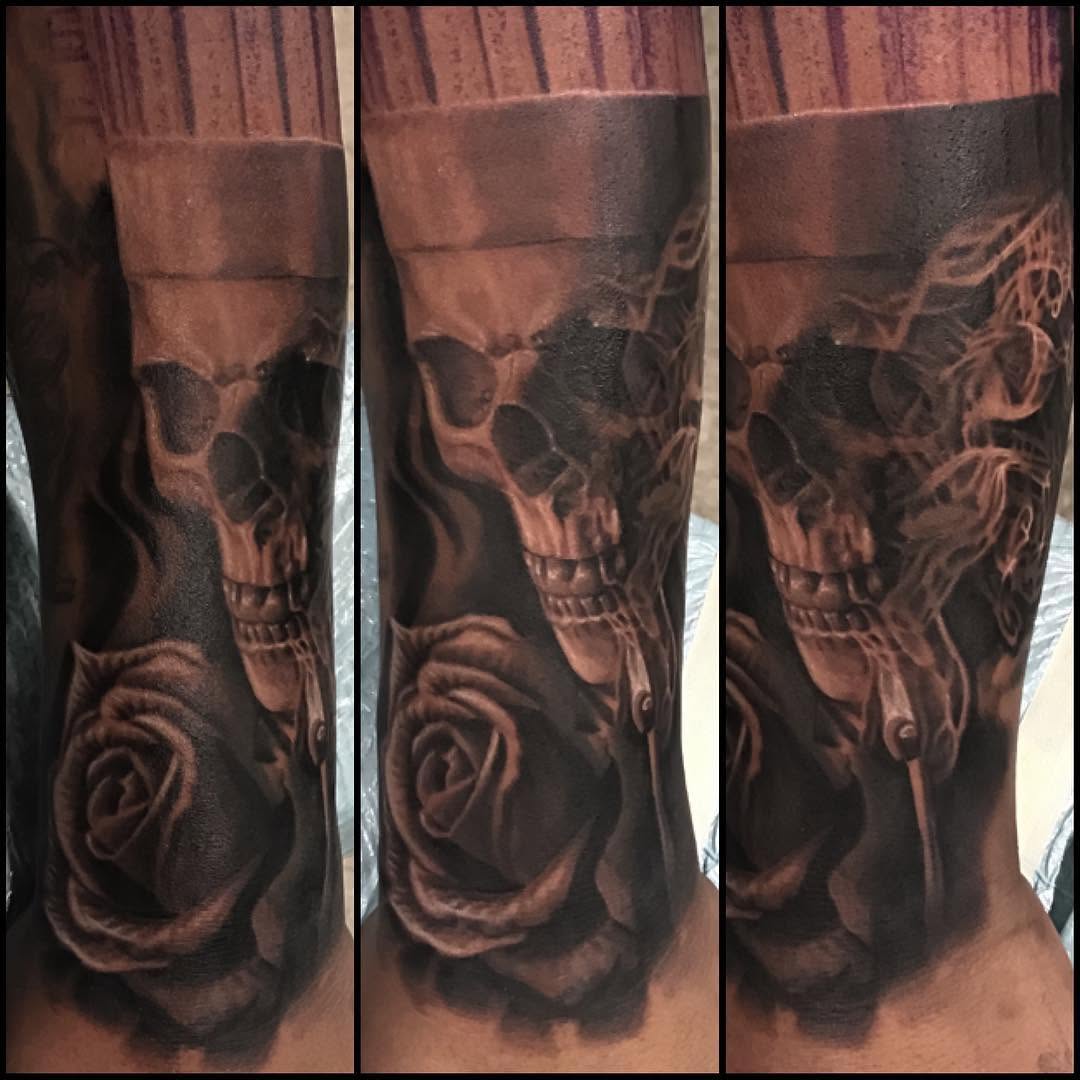 Black-and-grey skull and rose tattoo, forearm