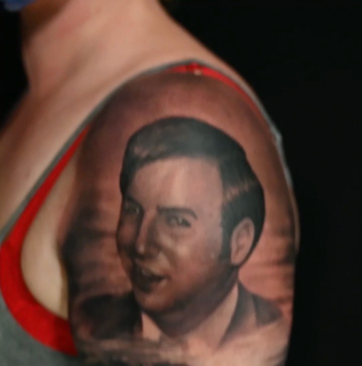 Black-and-grey memorial portrait, shoulder