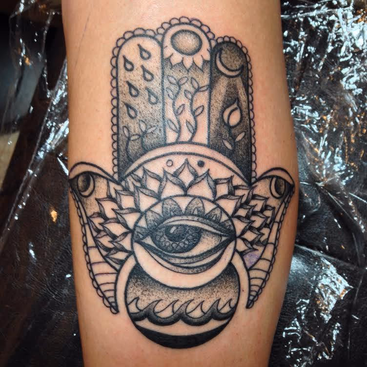 Hamza hand with stippled shading.