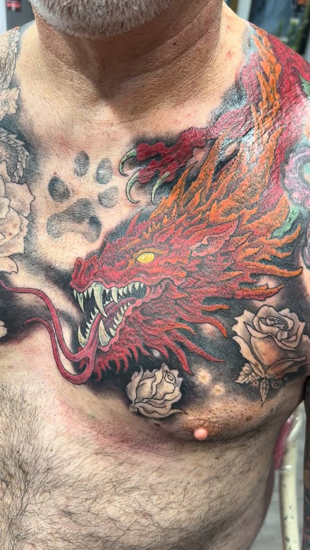 Red dragon with roses memorial chest tattoo