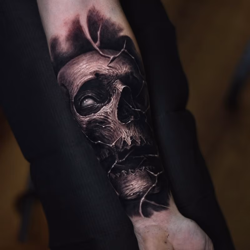 Skull forearm tattoo