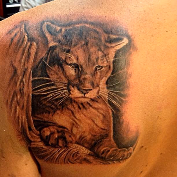 black and grey Mountain lion tattoo done by cesar perez from keene NH.