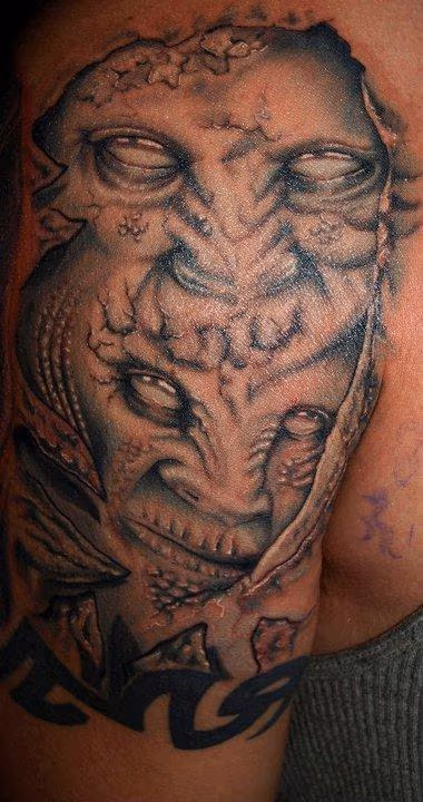 black and grey demos faces tattoo