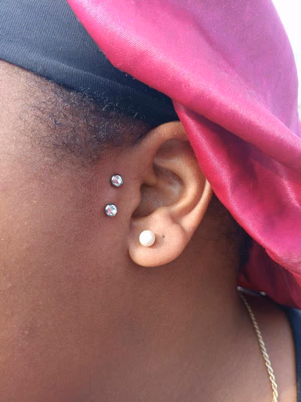 tragus surface bar piercing