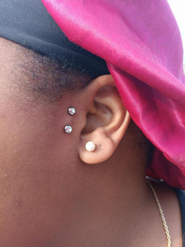 tragus surface bar piercing