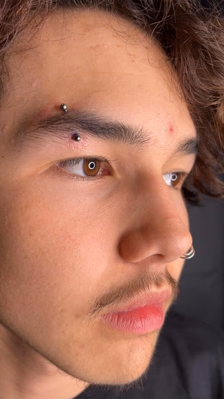Eyebrow Piercing by Kimber CareBear