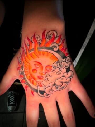 Sun and moon tattoo by SlyFox