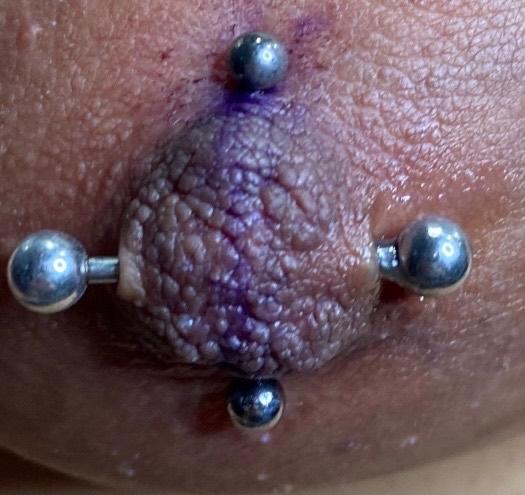 Vertical Nipple Piercing