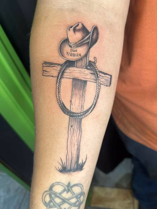 cowboy themed cross tattoo by Buddy Boy