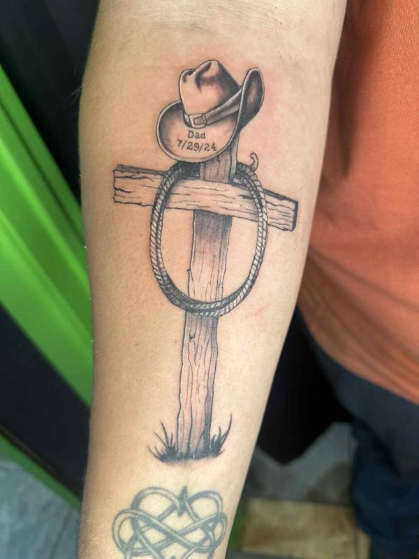 cowboy themed cross tattoo by Buddy Boy