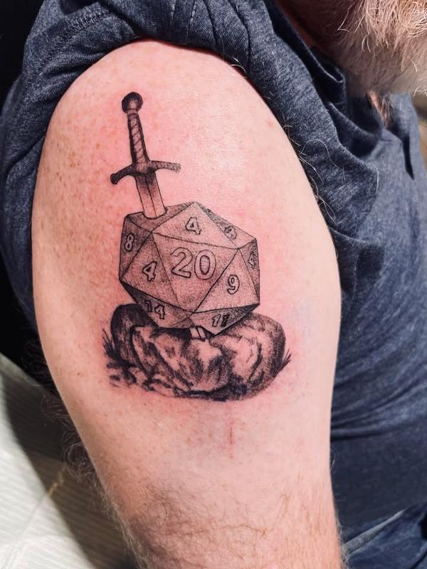 sword in the stone dungeons and dragons tattoo by Angel Hurtado