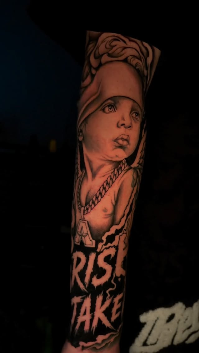 Black-and-grey portrait sleeve with angel and text
