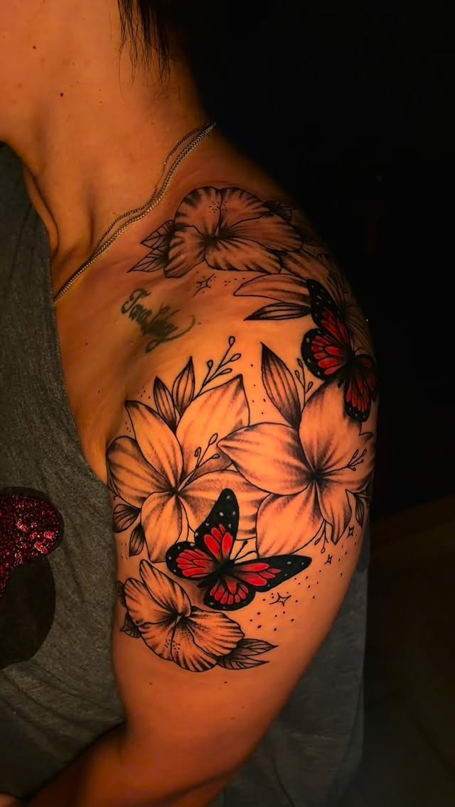 Floral butterfly shoulder tattoo with color