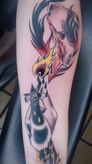 Surreal demon head with flames color tattoo, forearm