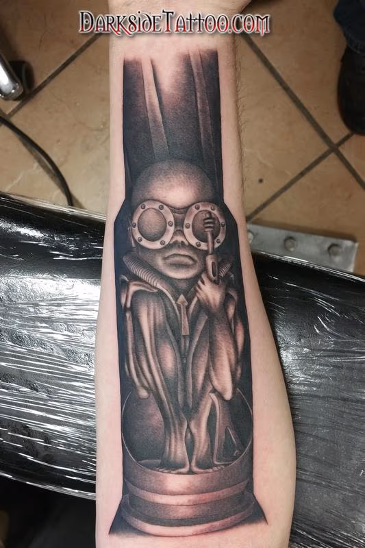 Black and Gray Giger Baby Tattoo