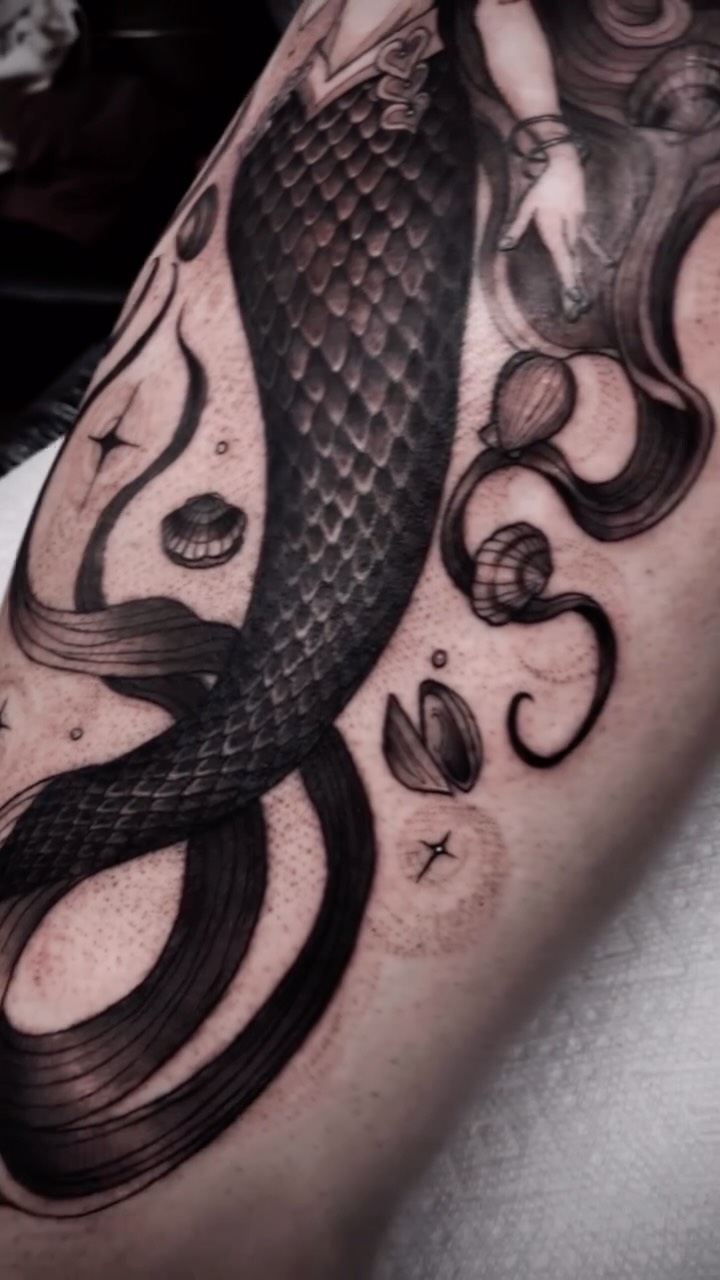 Black-and-grey mermaid tattoo, arm