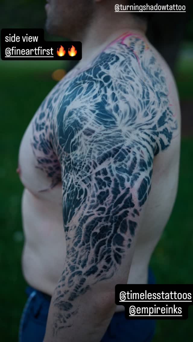 Black-and-grey biomechanical full sleeve tattoo