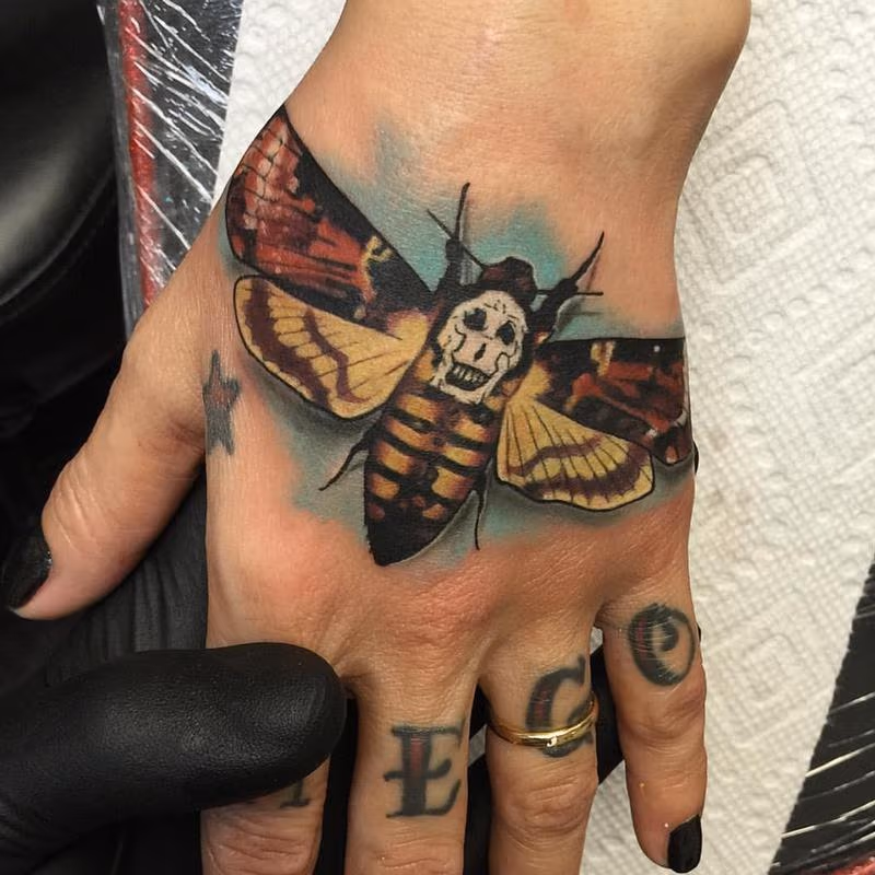 Dead Head Moth Hand Tattoo