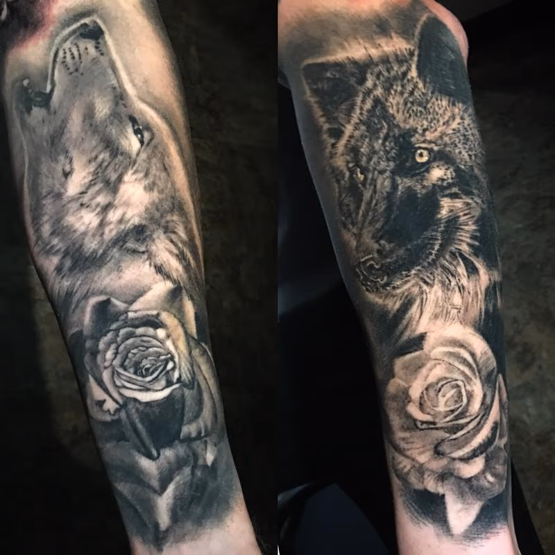 black and grey wolves and roses tattoo