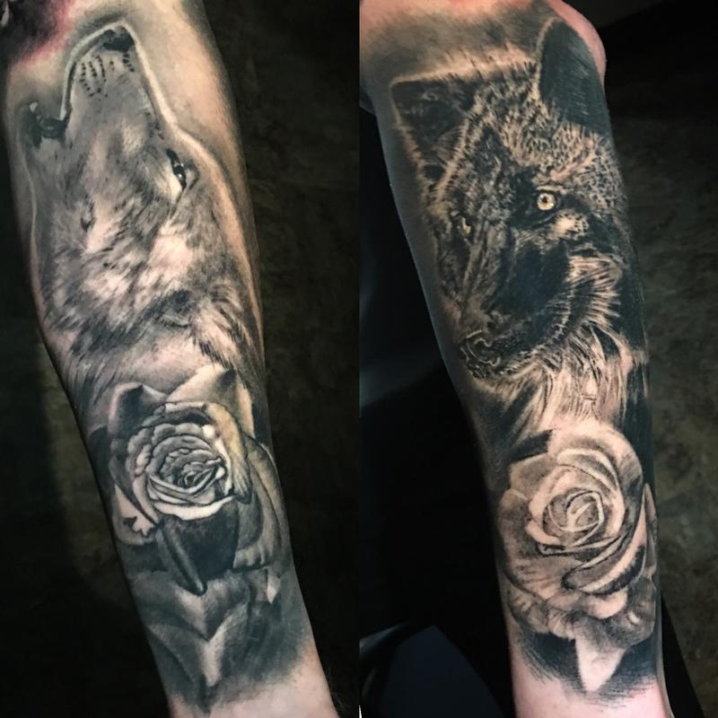 black and grey wolves and roses tattoo