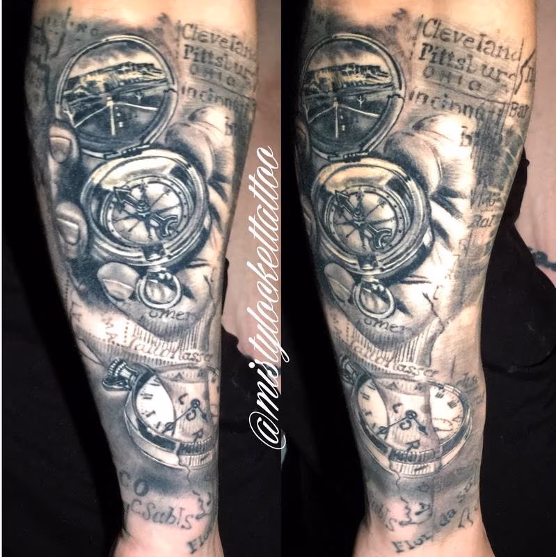Black and grey watch, compass, map sleeve