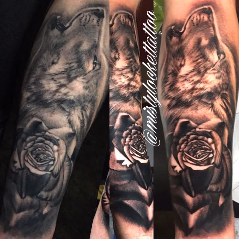 Black and grey wolf with rose