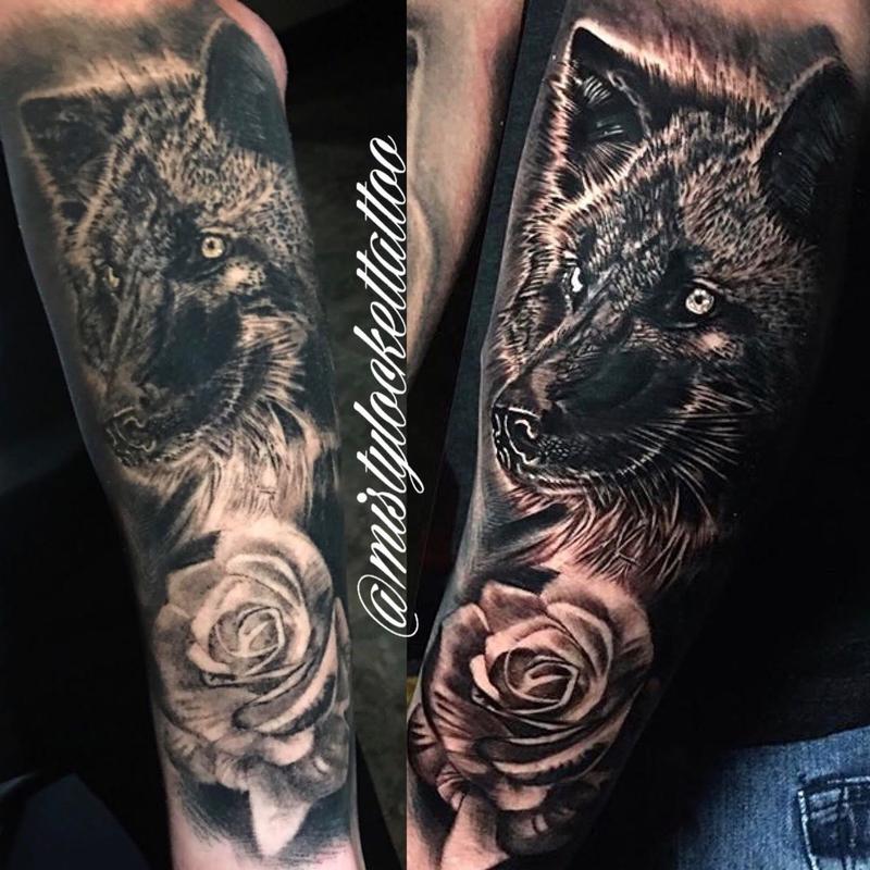 Black and grey wolf with rose