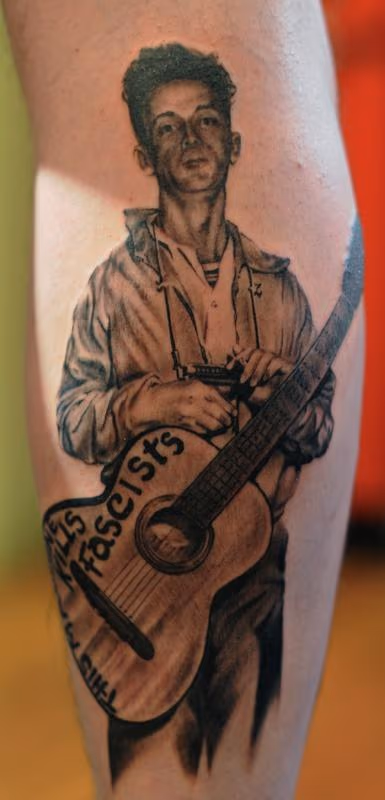 Woody Guthrie portrait tattoo