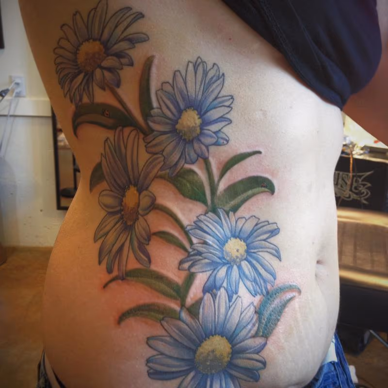 daisy flower color tattoo