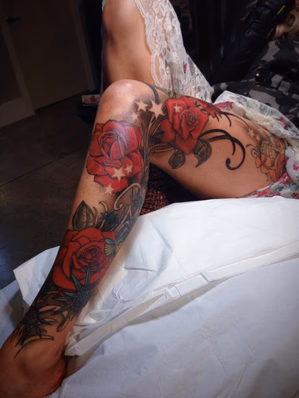 red rose and ornate blackwork tattoo